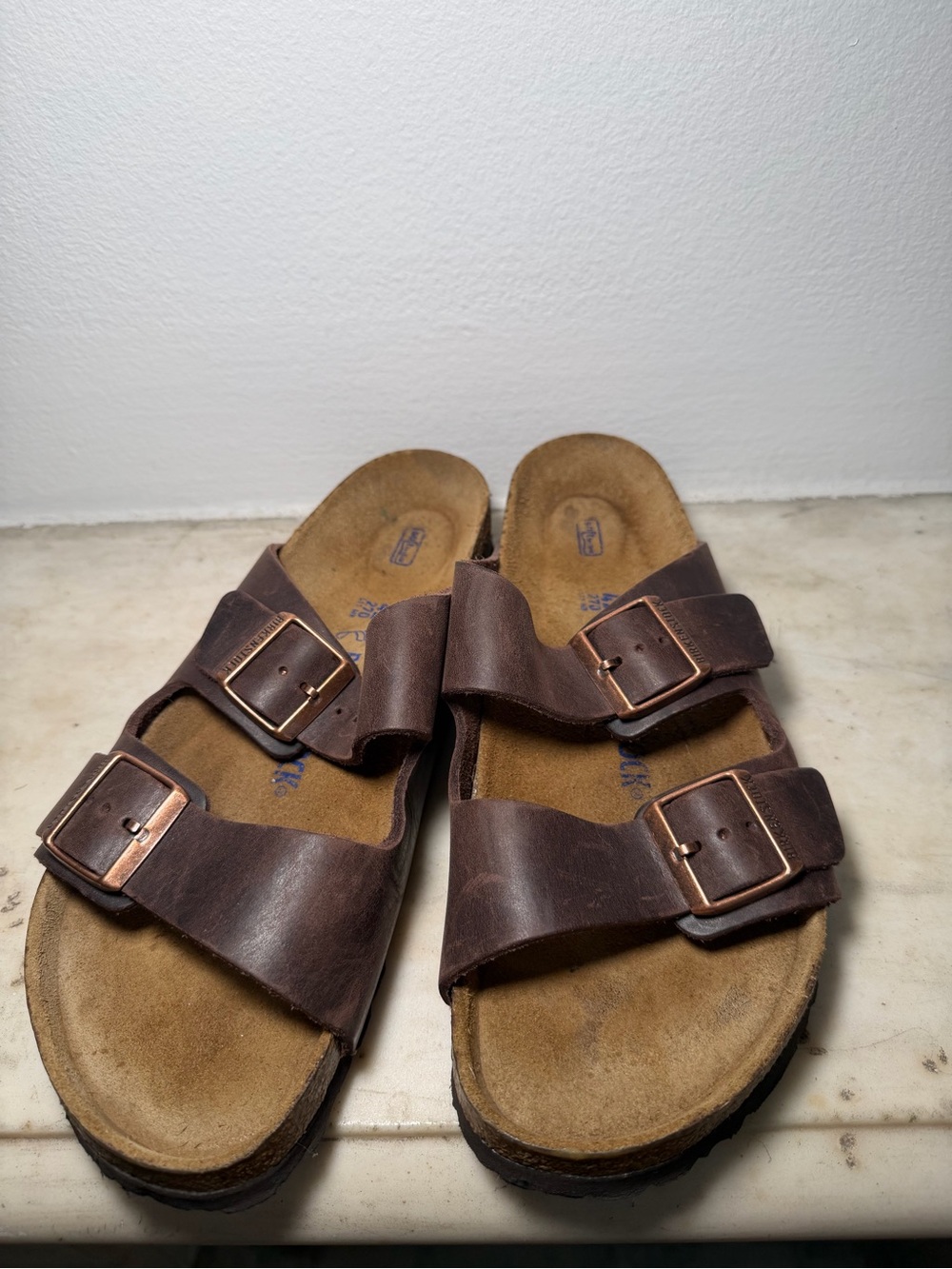 Authentic Birkenstock Arizona two-strap sandals in brown leather.